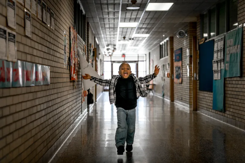 Ziare Gunn, 5, runs down the hallway in excitement at the Ford Early Learning Center in Ypsilanti. Gunn memorized and recited the poem “Hey Black Child” by Useni Eugene Perkins during a meeting of Ypsilanti’s board of education as part of Black History Month. Members of the board were brought to tears by Gunn’s presentation. “Hey Black Child, be what you can be, learn what you must learn, do what you can do, and tomorrow your nation, will be what you want it to be.”