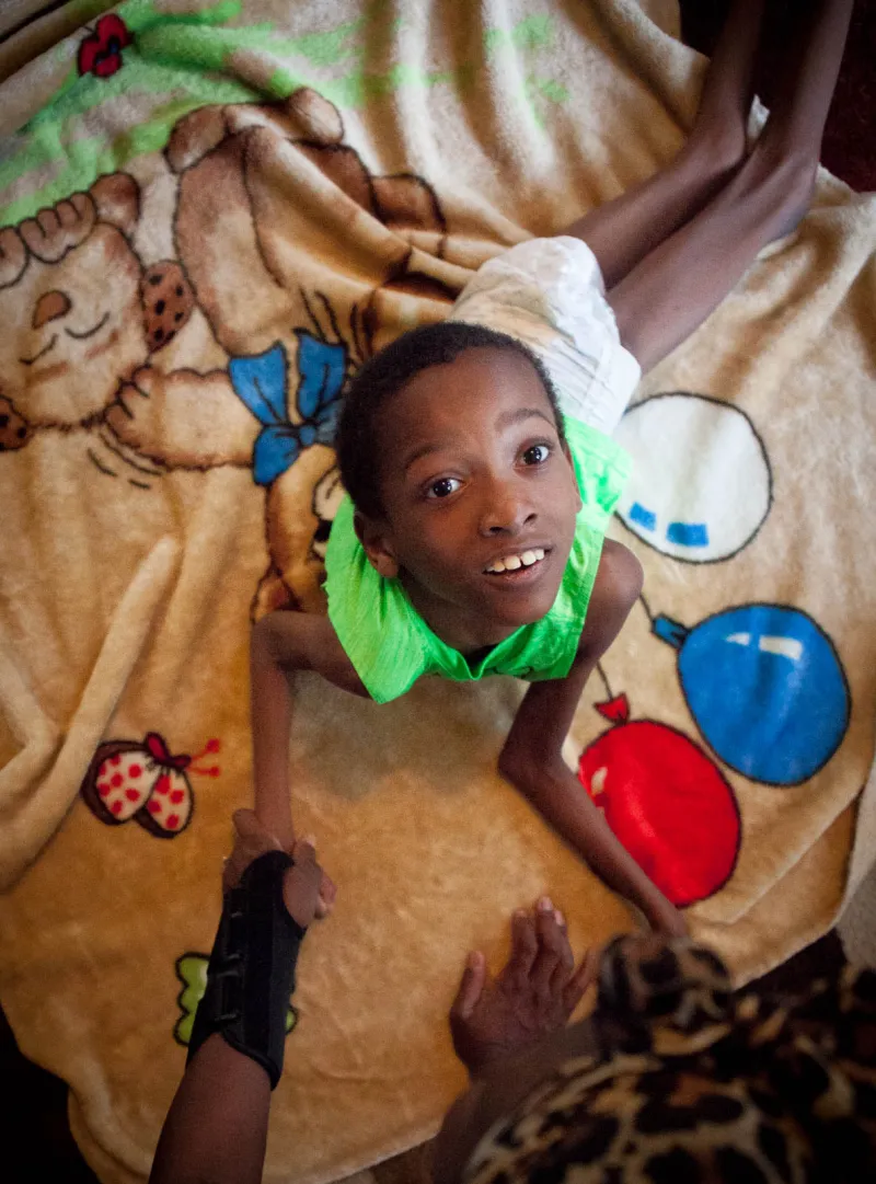 Keshaun Brown, nine years old, has Plasious-Merzbacher di sease, a rare disorder similar to muscular dystrophy. Brown has extremely limited mobility, and requires assistance with simple tasks. Keshaun's mother, Nakreisha, wanted this photo taken to show the severity of Keshaun's condition.