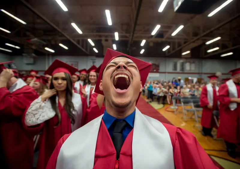 Juan Castelan, a high s chool graduate, hollers as the final diploma is issued at Horlick High School in Racine during the graduation ceremonies.